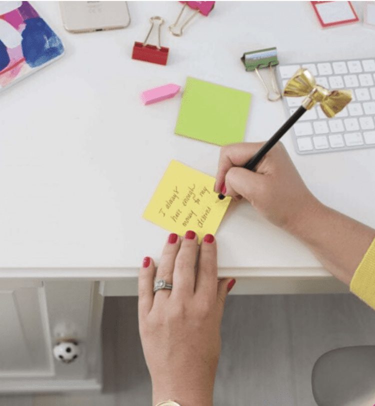 Emily Williams writing on a sticky note