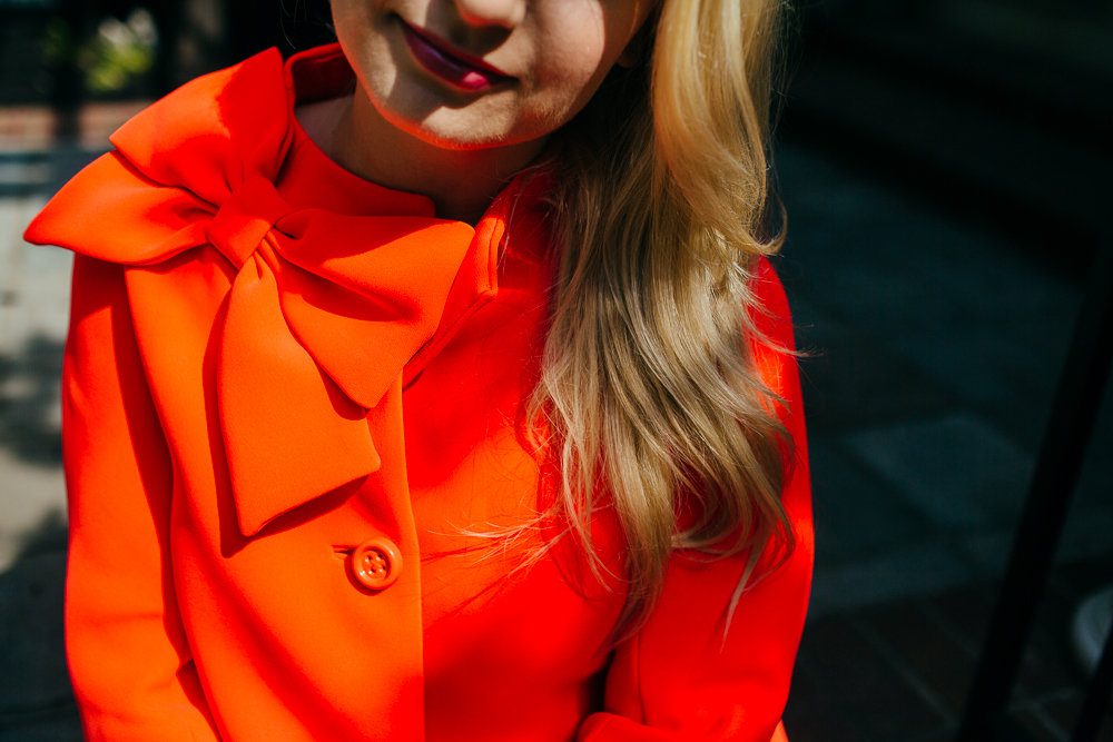 Emily Williams wearing an orange jacket