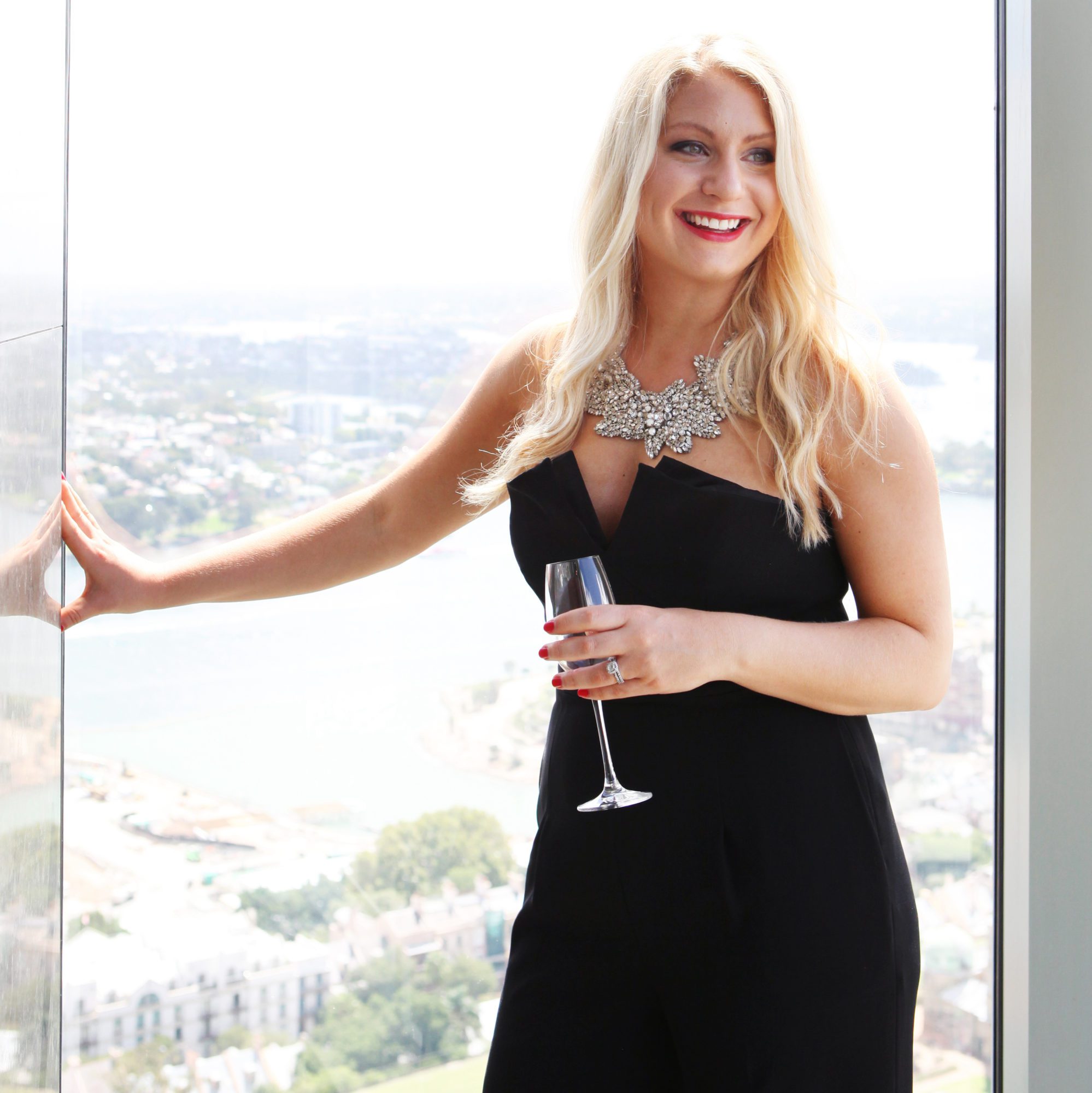 Emily Williams Holding Champagne in Sydney Australia