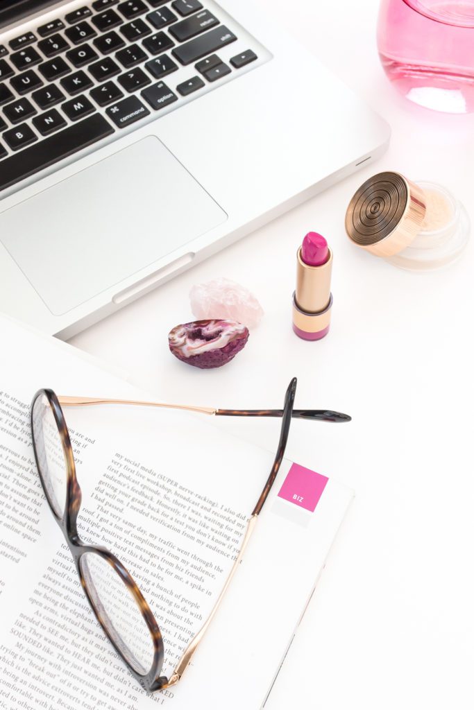 Book, glasses, laptop, and lipstick.