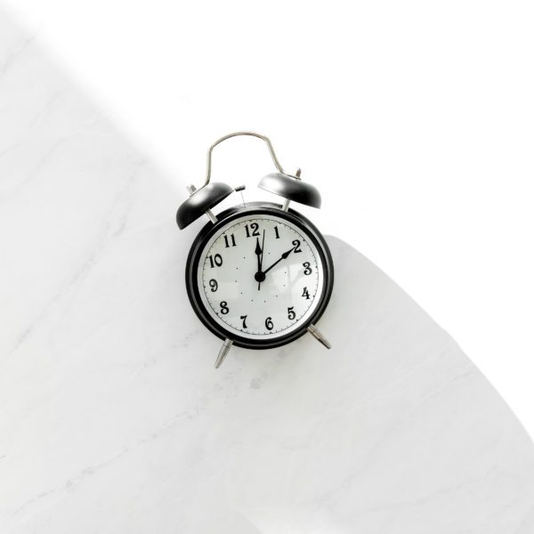 Black and white clock on marble
