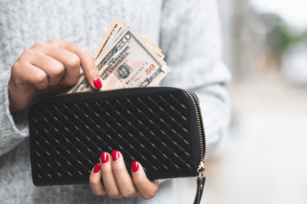 Woman holding her wallet.