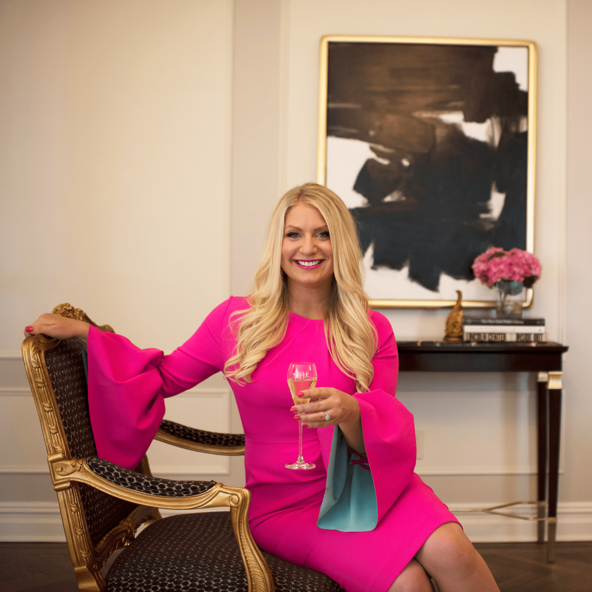 Emily Williams holding a glass of champagne