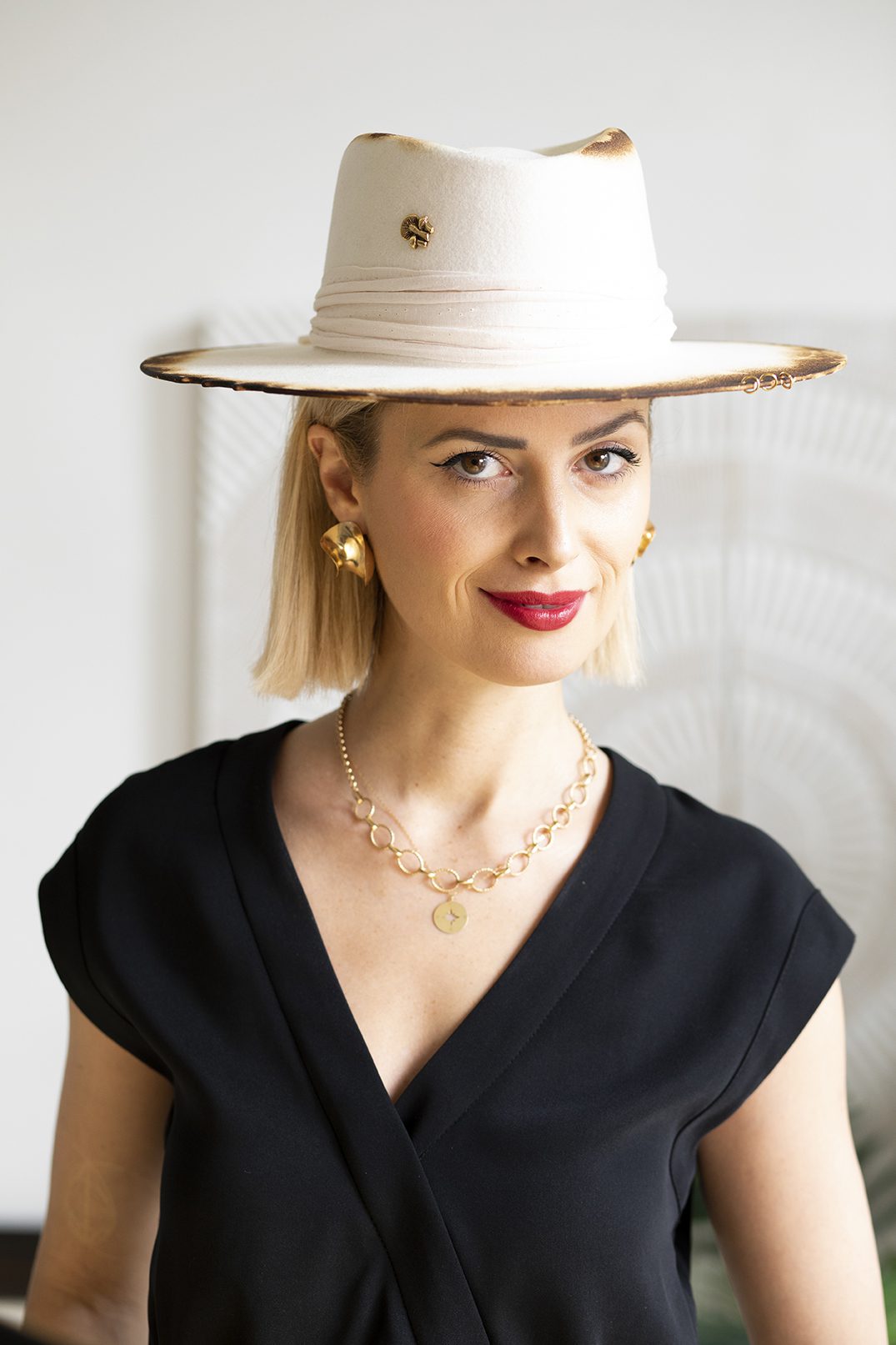 Dorota Stanczyk smiling and wearing beige hat